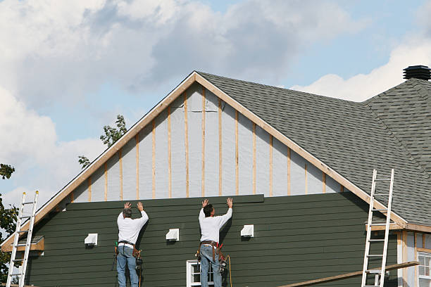 Professional Storm Damage Siding Repair technician working in Bunn, NC
